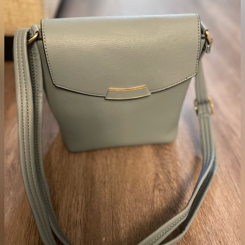 Light blue small purse and makeup bag.